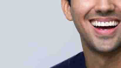 Woman smiles during a dental checkup